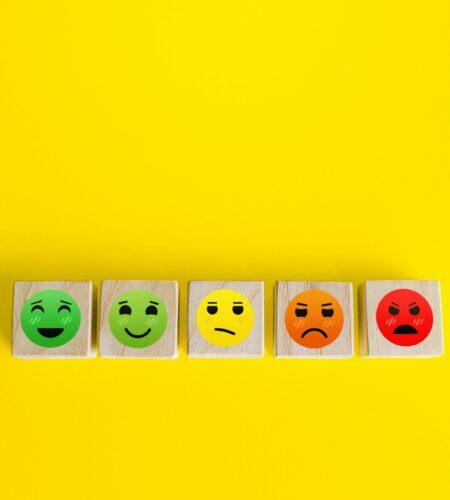 Mood faces from happy to angry on wooden blocks. Concept of rating, review. Visitor satisfaction