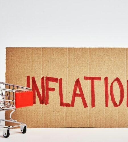 Consumers inflation concept, shopping trolley and word inflation